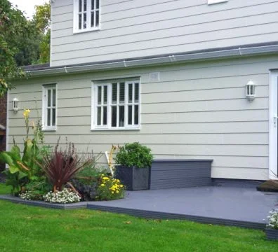Bardage fibres bois composite CANEXEL CED'R TEX SAHARA plus durable et solide que le bardage Kaycan naturetech