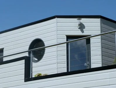Bardage fibres bois composite CANEXEL RIDGEWOOD GRIS BRUME plus durable et solide que le bardage Kaycan naturetech